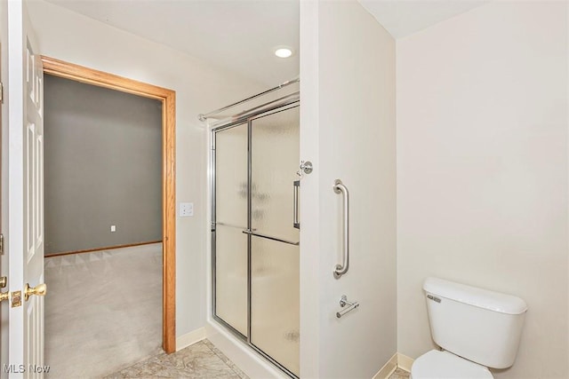 3840 Dartford Ln, Medina, OH 44256 - bathroom featuring a stall shower, baseboards, and toilet