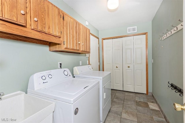 3840 Dartford Ln, Medina, OH 44256 - washroom featuring cabinet space, washing machine and clothes dryer, baseboards, and stone finish floors