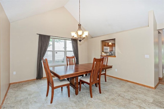 3840 Dartford Ln, Medina, OH 44256 - dining area featuring a chandelier, high vaulted ceiling, and baseboards