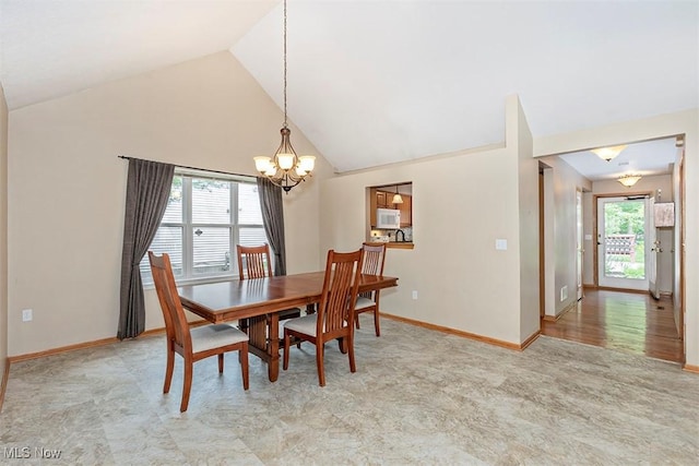 3840 Dartford Ln, Medina, OH 44256 - dining room featuring a chandelier, baseboards, high vaulted ceiling, and light carpet