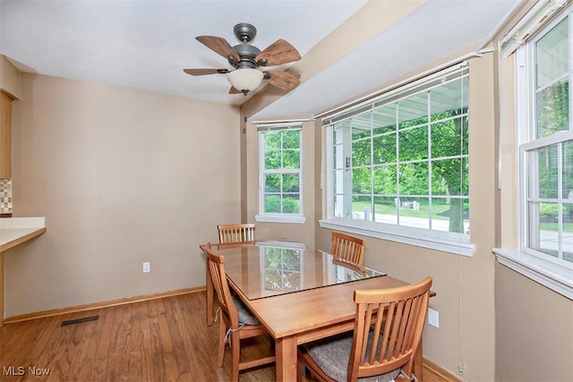 3840 Dartford Ln, Medina, OH 44256 - dining room featuring wood finished floors, baseboards, and ceiling fan