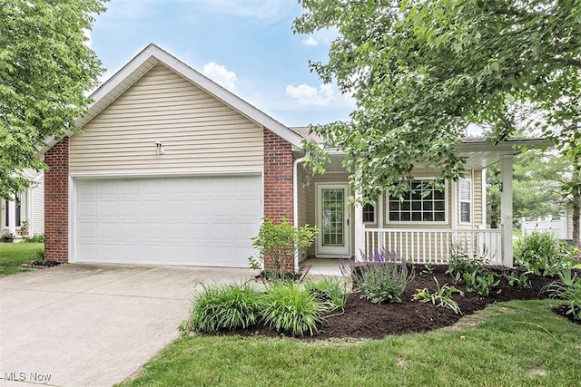 3840 Dartford Ln, Medina, OH 44256 - single story home with a porch, driveway, brick siding, and an attached garage