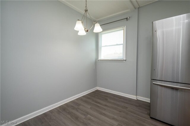 117 N Navarre Ave, Youngstown, OH 44515 - unfurnished dining area with a chandelier, vaulted ceiling, dark wood-type flooring, and baseboards