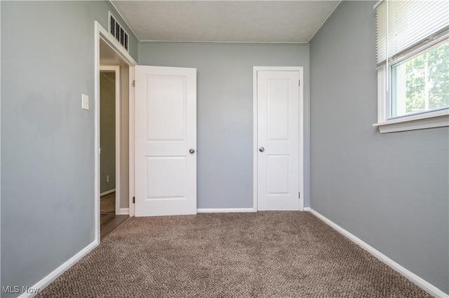 117 N Navarre Ave, Youngstown, OH 44515 - unfurnished bedroom featuring carpet floors and baseboards