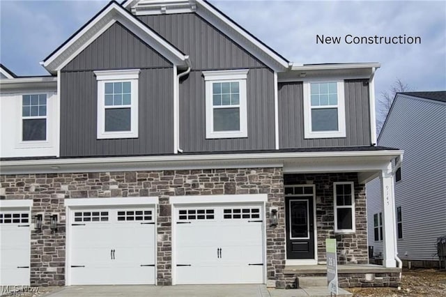 9145 Ledge View Ter, Broadview Heights, OH 44147 - craftsman inspired home featuring stone siding, an attached garage, driveway, and covered porch