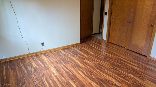 2615 Orchard Park St NW, Canton, OH 44718 - unfurnished bedroom with baseboards and wood finished floors