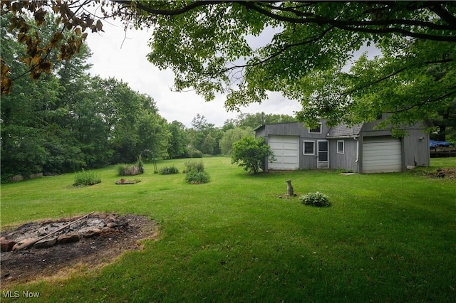 5286 Egypt Rd, Smithville, OH 44677 - view of green lawn with an outbuilding and a garage