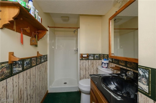 5286 Egypt Rd, Smithville, OH 44677 - bathroom with a wainscoted wall, toilet, vanity, a walk in shower, and a textured ceiling