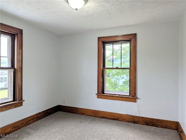 623 Cole Ave, Akron, OH 44301 - spare room with carpet flooring, baseboards, and a textured ceiling