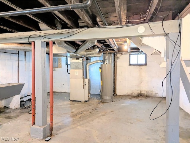 623 Cole Ave, Akron, OH 44301 - below grade area featuring water heater, heating unit, and electric panel