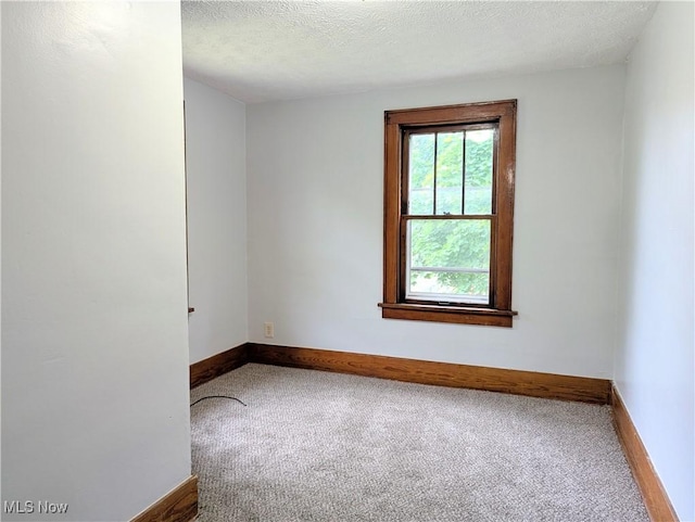 623 Cole Ave, Akron, OH 44301 - carpeted empty room featuring baseboards and a textured ceiling