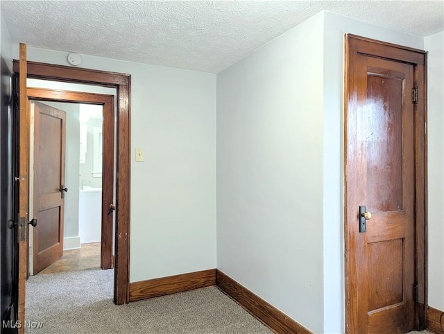 623 Cole Ave, Akron, OH 44301 - spare room with carpet flooring, a smoke detector, baseboards, and a textured ceiling