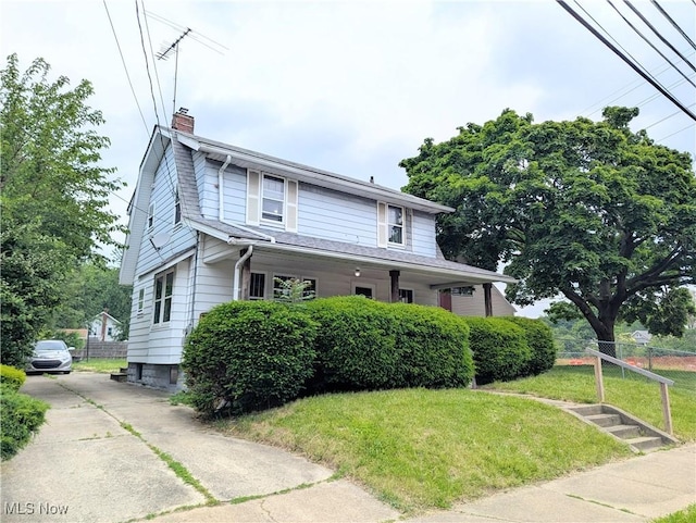 623 Cole Ave, Akron, OH 44301 - view of front facade featuring a chimney and driveway
