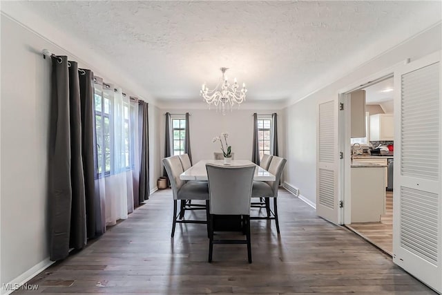 17314 Lomond Blvd, Shaker Heights, OH 44120 - dining area with a chandelier, a textured ceiling, and wood finished floors