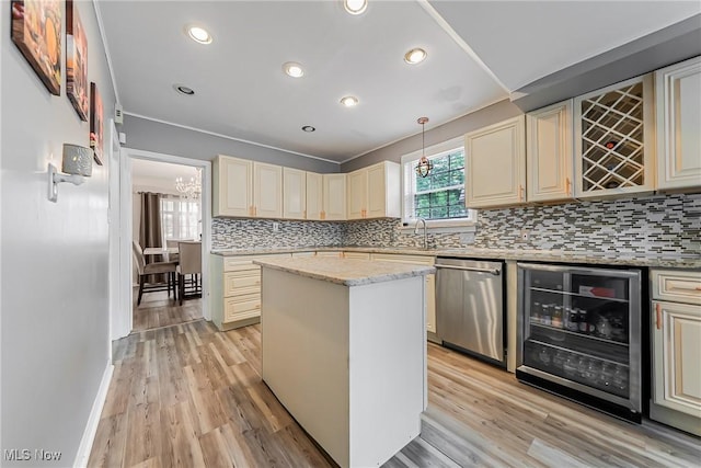 17314 Lomond Blvd, Shaker Heights, OH 44120 - kitchen featuring stainless steel dishwasher, wine cooler, cream cabinetry, decorative backsplash, and a kitchen island