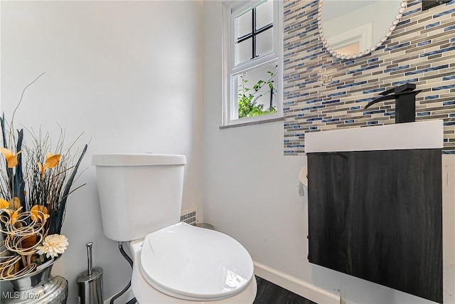 17314 Lomond Blvd, Shaker Heights, OH 44120 - bathroom with backsplash, wood finished floors, and vanity