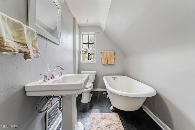 17314 Lomond Blvd, Shaker Heights, OH 44120 - bathroom featuring vaulted ceiling, a freestanding tub, and wood finished floors