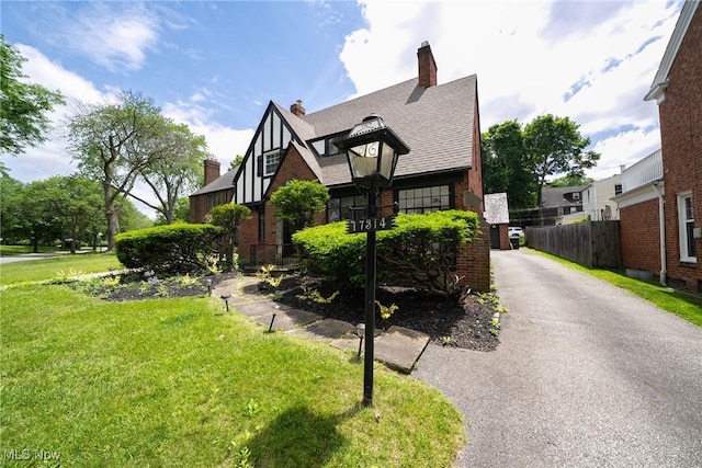 17314 Lomond Blvd, Shaker Heights, OH 44120 - view of front facade with a chimney and a shingled roof