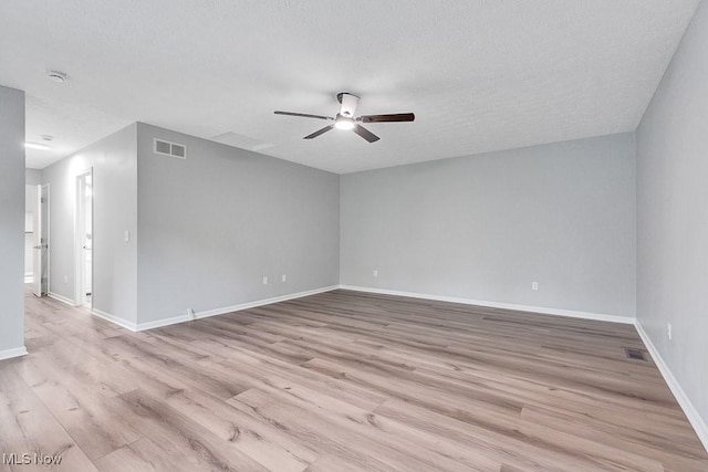 8000 Lake Rd, Seville, OH 44273 - unfurnished room with ceiling fan, light wood-type flooring, baseboards, and a textured ceiling