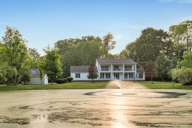 8000 Lake Rd, Seville, OH 44273 - view of front of home with a balcony, curved driveway, and a front yard