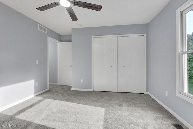 8000 Lake Rd, Seville, OH 44273 - unfurnished bedroom featuring carpet, a closet, baseboards, and ceiling fan