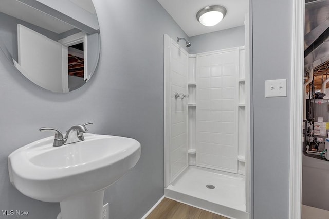 8000 Lake Rd, Seville, OH 44273 - full bathroom featuring a shower stall, wood finished floors, a sink, and baseboards