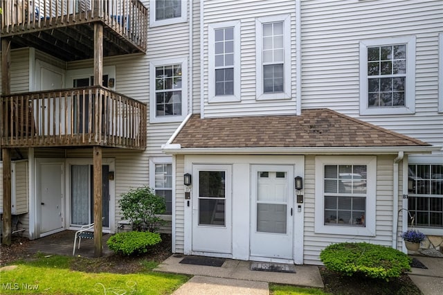 28140 Detroit Rd Unit D3, Westlake, OH 44145 - view of exterior entry featuring a balcony and roof with shingles