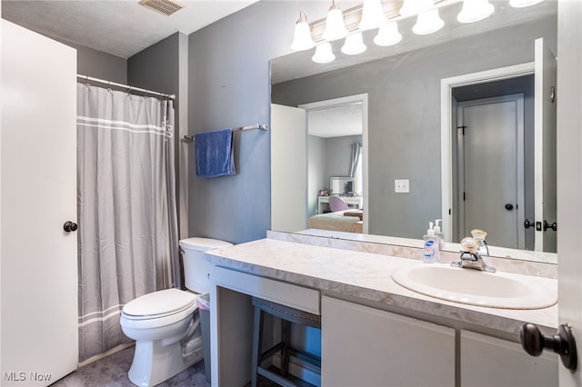 28140 Detroit Rd Unit D3, Westlake, OH 44145 - bathroom featuring toilet, vanity, ensuite bath, tile patterned floors, and a shower with curtain