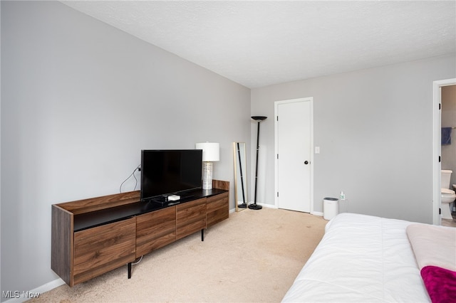 28140 Detroit Rd Unit D3, Westlake, OH 44145 - bedroom with light colored carpet, baseboards, and ensuite bath