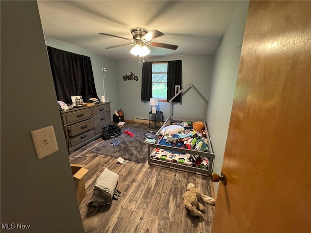 85 Arrow Rd NW, Carrollton, OH 44615 - bedroom with wood finished floors, a ceiling fan, and baseboards