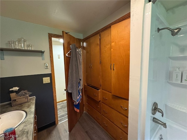 85 Arrow Rd NW, Carrollton, OH 44615 - full bathroom featuring wood finished floors, vanity, and bathing tub / shower combination