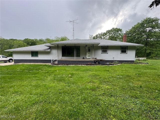 85 Arrow Rd NW, Carrollton, OH 44615 - rear view of property featuring a lawn, a chimney, and covered porch