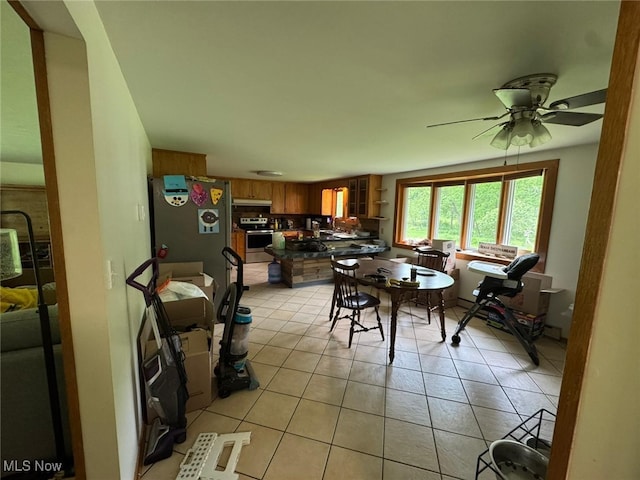 85 Arrow Rd NW, Carrollton, OH 44615 - dining space featuring a ceiling fan and light tile patterned floors