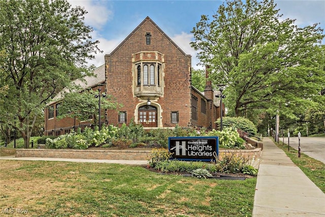 2725 Hampshire Rd Unit 2, Cleveland Heights, OH 44106 - english style home featuring brick siding and a front lawn