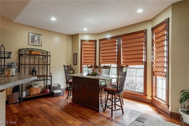 471 Buck Run, Pennsboro, WV 26415 - dining room featuring dark wood finished floors, a textured ceiling, recessed lighting, and an office area