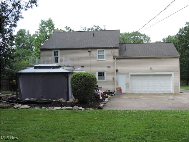14610 Onaway Rd, Shaker Heights, OH 44120 - back of house featuring concrete driveway and a yard