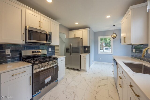 17607 Scottsdale Blvd, Shaker Heights, OH 44120 - kitchen featuring stainless steel appliances, a sink, recessed lighting, light marble finish flooring, and baseboards