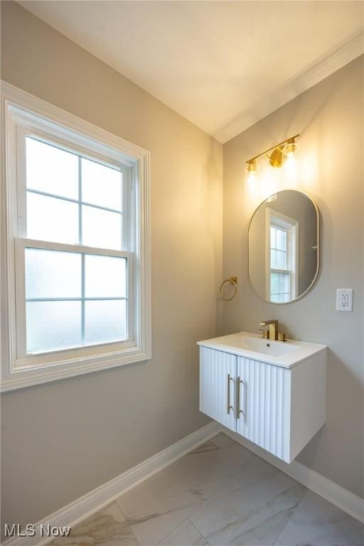 17607 Scottsdale Blvd, Shaker Heights, OH 44120 - bathroom with marble look tiles, baseboards, and vanity