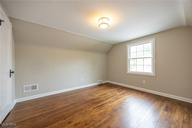 17607 Scottsdale Blvd, Shaker Heights, OH 44120 - bonus room with vaulted ceiling, dark wood-style floors, and baseboards