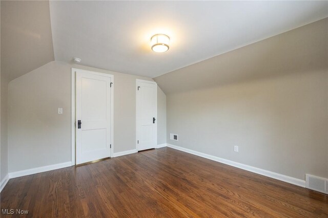 17607 Scottsdale Blvd, Shaker Heights, OH 44120 - bonus room with lofted ceiling, dark wood-type flooring, and baseboards