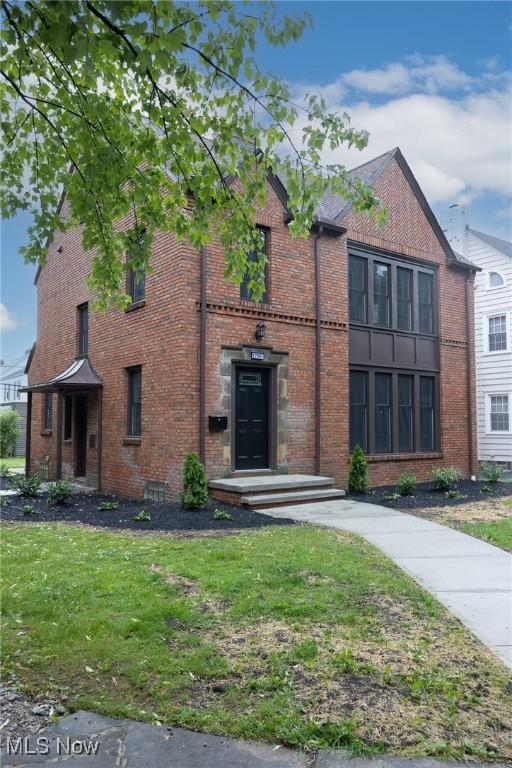 17607 Scottsdale Blvd, Shaker Heights, OH 44120 - view of front of property featuring brick siding and a front lawn