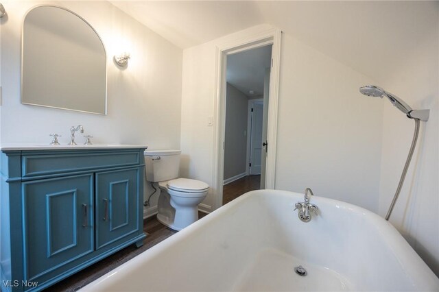17607 Scottsdale Blvd, Shaker Heights, OH 44120 - full bathroom with a freestanding bath, toilet, vanity, wood finished floors, and baseboards