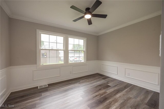 17607 Scottsdale Blvd, Shaker Heights, OH 44120 - unfurnished room with ceiling fan, a wainscoted wall, dark wood-style floors, and ornamental molding