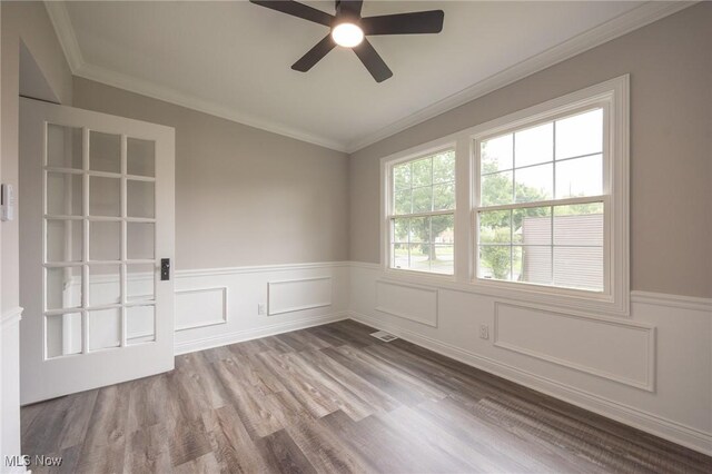 17607 Scottsdale Blvd, Shaker Heights, OH 44120 - empty room featuring a ceiling fan, wainscoting, wood finished floors, and crown molding