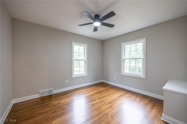 17607 Scottsdale Blvd, Shaker Heights, OH 44120 - spare room with healthy amount of natural light, wood finished floors, ceiling fan, and baseboards