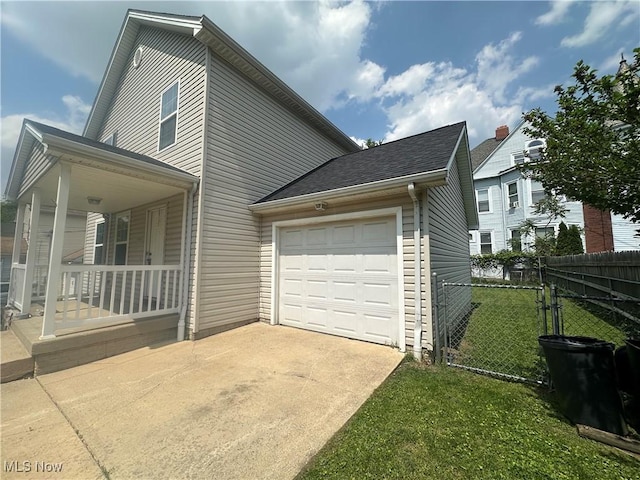 4322 Coleman Ave, Ashtabula, OH 44004 - view of property exterior with concrete driveway, covered porch, and an attached garage