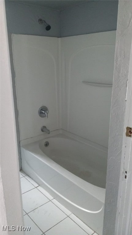 11705 Fairport Ave, Cleveland, OH 44108 - full bath featuring tile patterned flooring and shower / washtub combination
