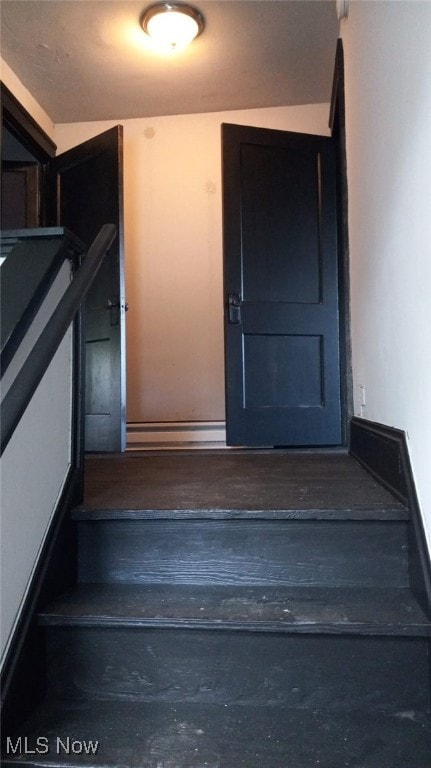 11705 Fairport Ave, Cleveland, OH 44108 - stairway featuring baseboards