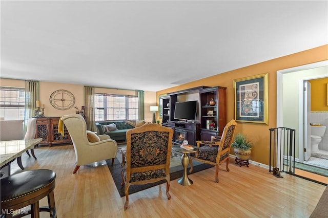 18975 Van Aken Blvd Unit 401, Shaker Heights, OH 44122 - living room featuring plenty of natural light, light wood finished floors, and baseboards