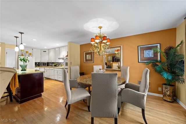 18975 Van Aken Blvd Unit 401, Shaker Heights, OH 44122 - dining room with a chandelier, light wood finished floors, baseboards, and recessed lighting
